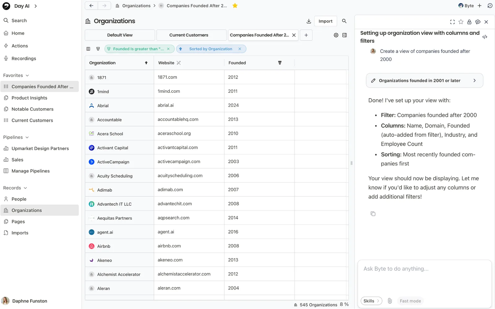 An Organizations table filtered to companies founded after 2000, set up by the Assistant from a chat request